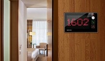 Simple Slave Economy Series bell unit installed on hotel room wall — showing room number 1602 in red LED display with DND and service icons in corridor context