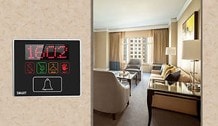 Sophi Series touch bell panel installed on hotel room wall — showing DND and service request icons in context